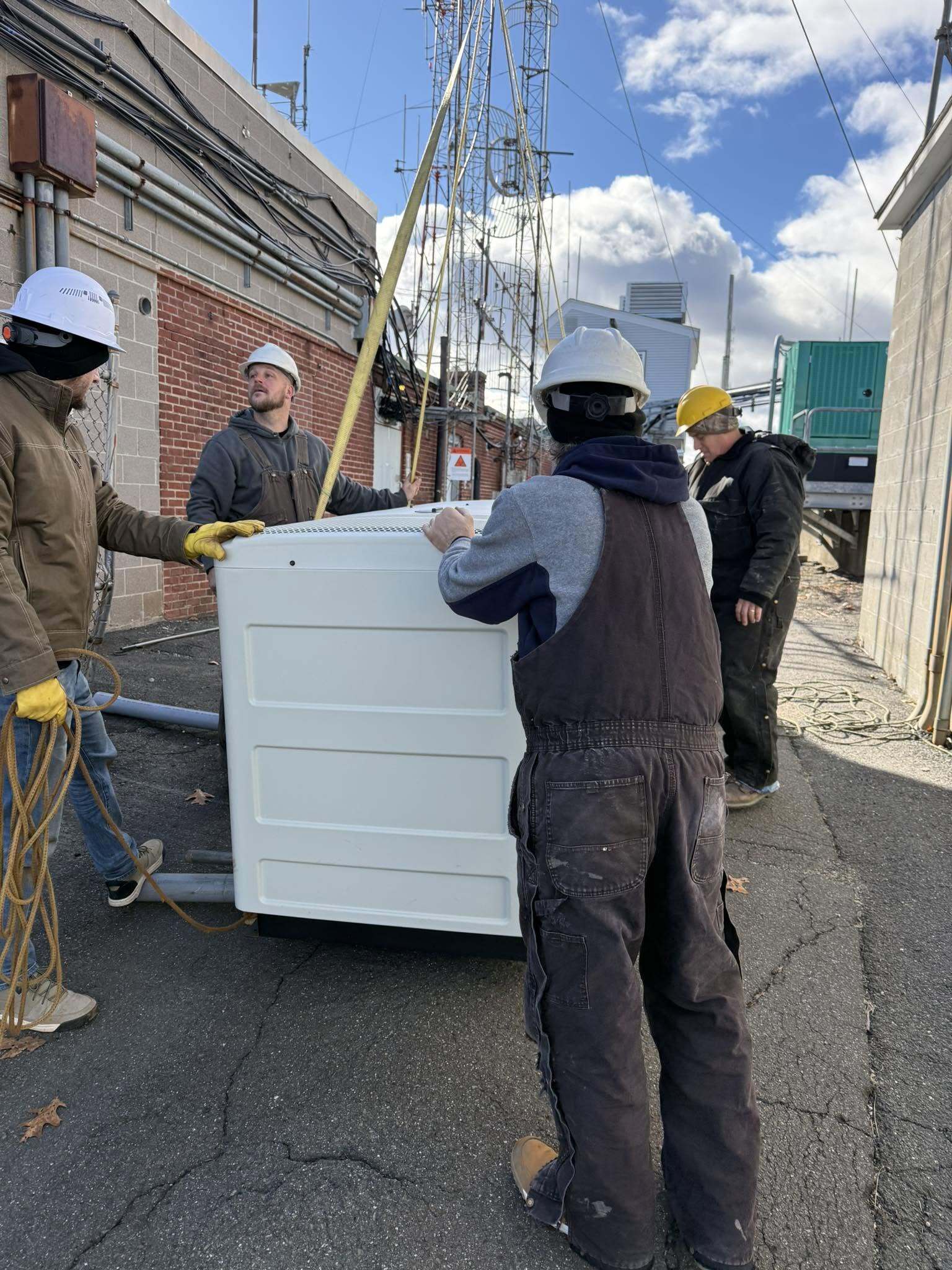 crew moving standby generator, Andrus Power Solutions