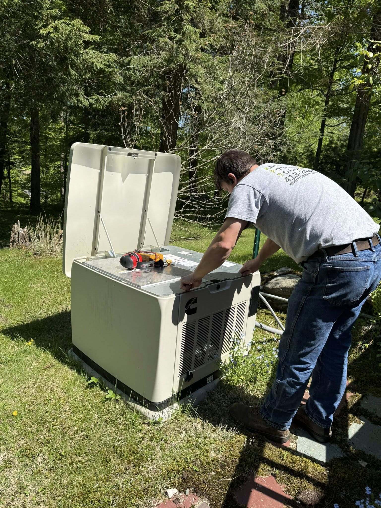 technician servicing standby generator, Andrus Power Solutions